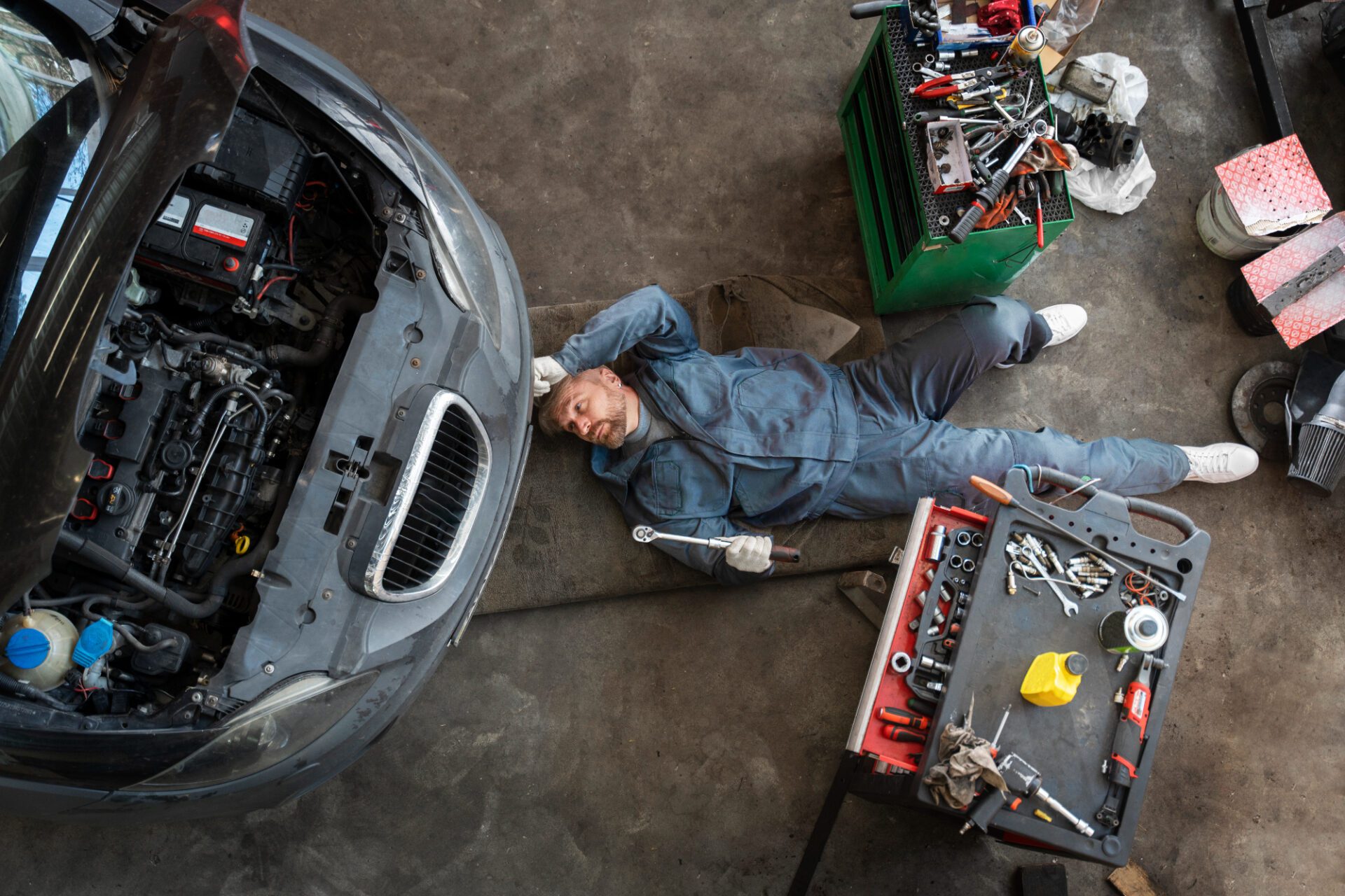 Top view man repairing car